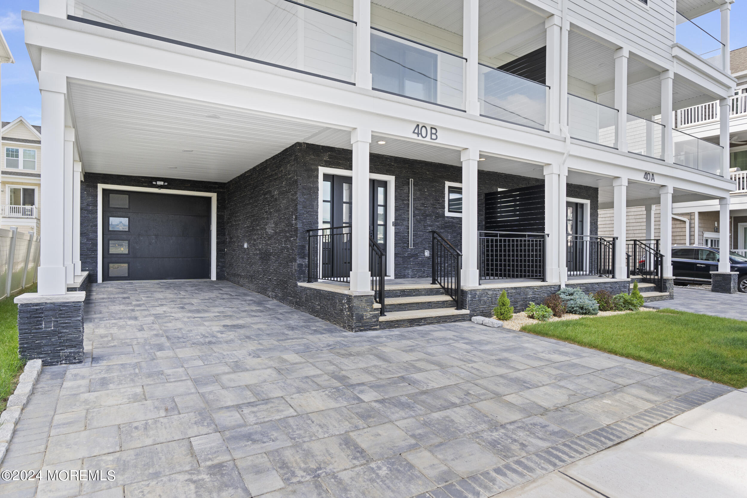 40 Seaview Avenue, Unit B Long Branch, NJ 07740 - Photo 7 of 81 front view of a brick house with a yard