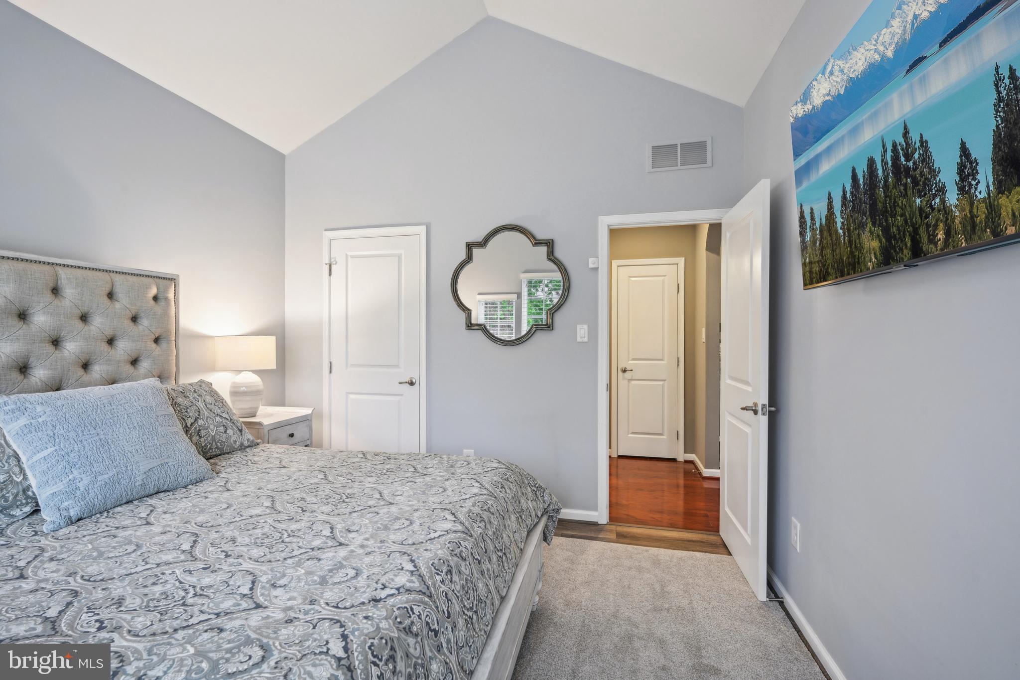 17 Alcott Way Marlton, NJ 08053 - Photo 26 of 43 a bedroom with a large bed and a chandelier
