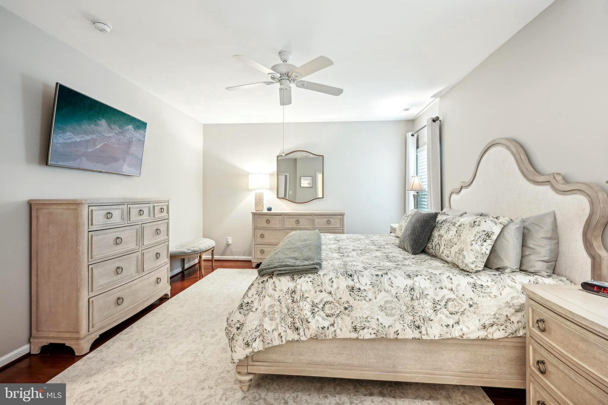 17 Alcott Way Marlton, NJ 08053 - Photo 29 of 43 a bedroom with a bed a mirror on dresser and a chandelier