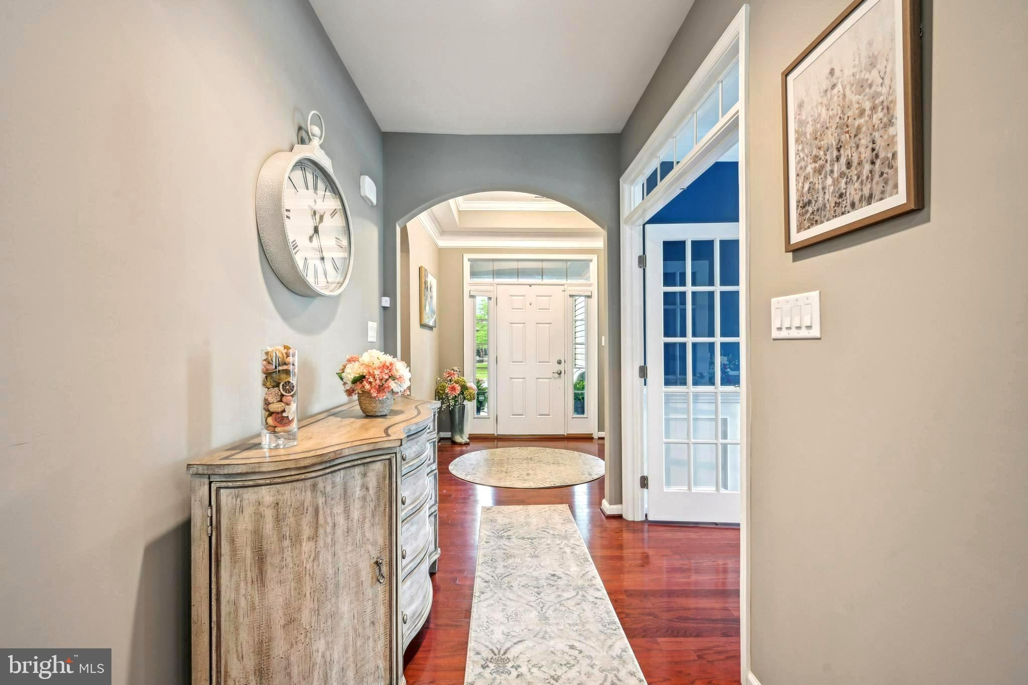17 Alcott Way Marlton, NJ 08053 - Photo 7 of 43 a hallway with painting on the wall and a large mirror