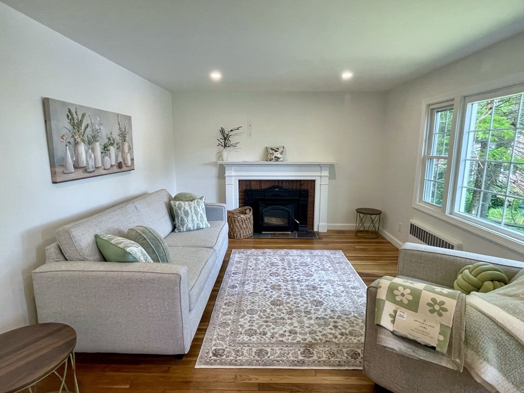 19 Robinwood Drive Canton, MA 02021 - Photo 4 of 12 a living room with furniture and a fireplace