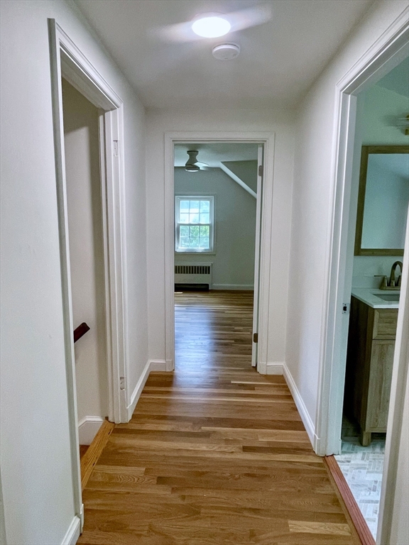 19 Robinwood Drive Canton, MA 02021 - Photo 10 of 12 a view of a hallway with wooden floor and closet