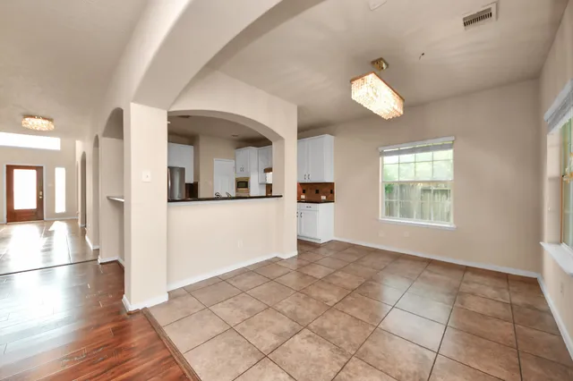 a view of a kitchen with a sink dishwasher and a refrigerator