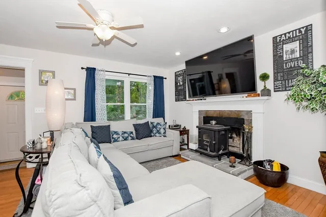 a bedroom with a bed couch and a window