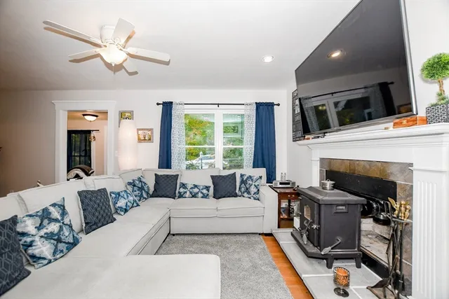 a living room with furniture and a flat screen tv