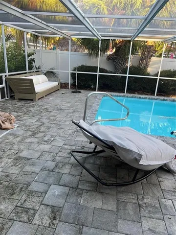 a view of a room with wooden floor and iron fence