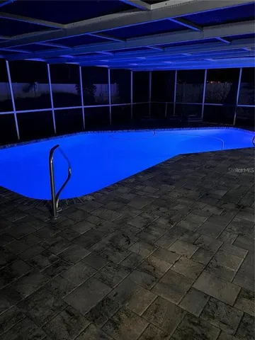 a view of a car is parked on the side of the road with city view