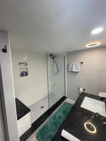 a bathroom with a sink and a mirror