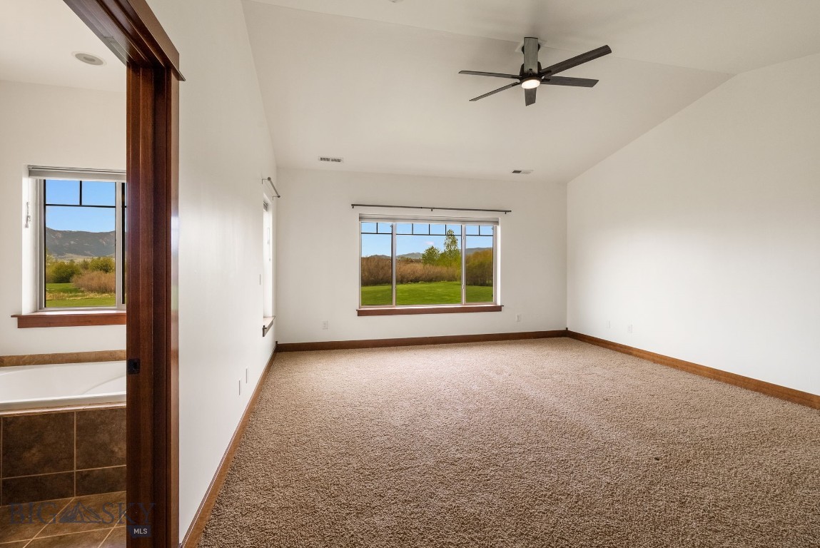 812 Rosa Way, Unit A Bozeman, MT 59718 - Photo 27 of 83 Primary bedroom with views to the park/open space