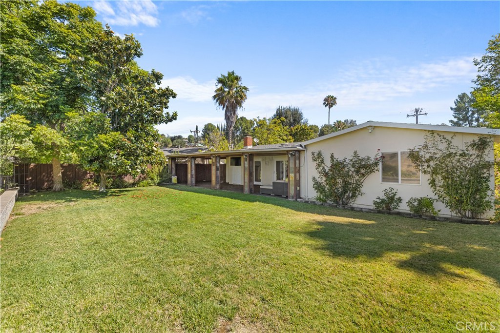 26096 Adamor Road Calabasas, CA 91302 - Photo 53 of 61 Large flat back yard with mosaic tile retaining seat wall.