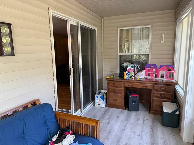 a room with furniture and a wooden floor