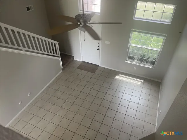 a view of an empty room and window