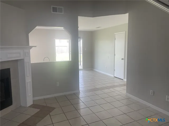 a view of an empty room and window