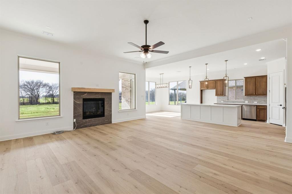 7016 Valley View Drive Joshua, TX 76058 - Photo 11 of 28 a view of a kitchen with furniture and a fireplace