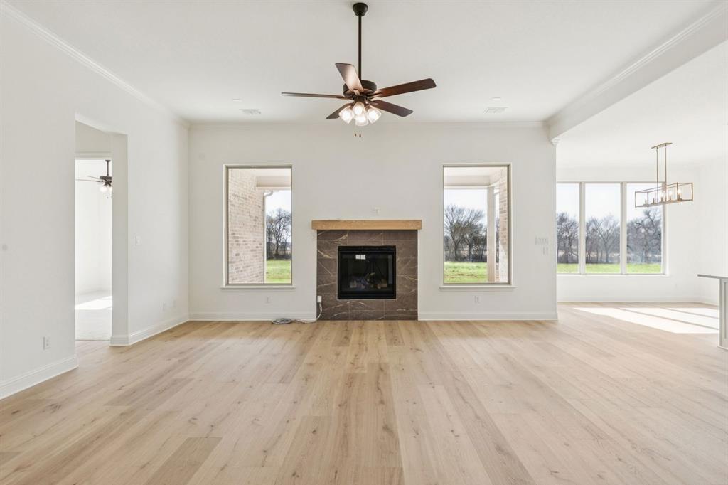 7016 Valley View Drive Joshua, TX 76058 - Photo 12 of 28 a view of an empty room with a window and fireplace
