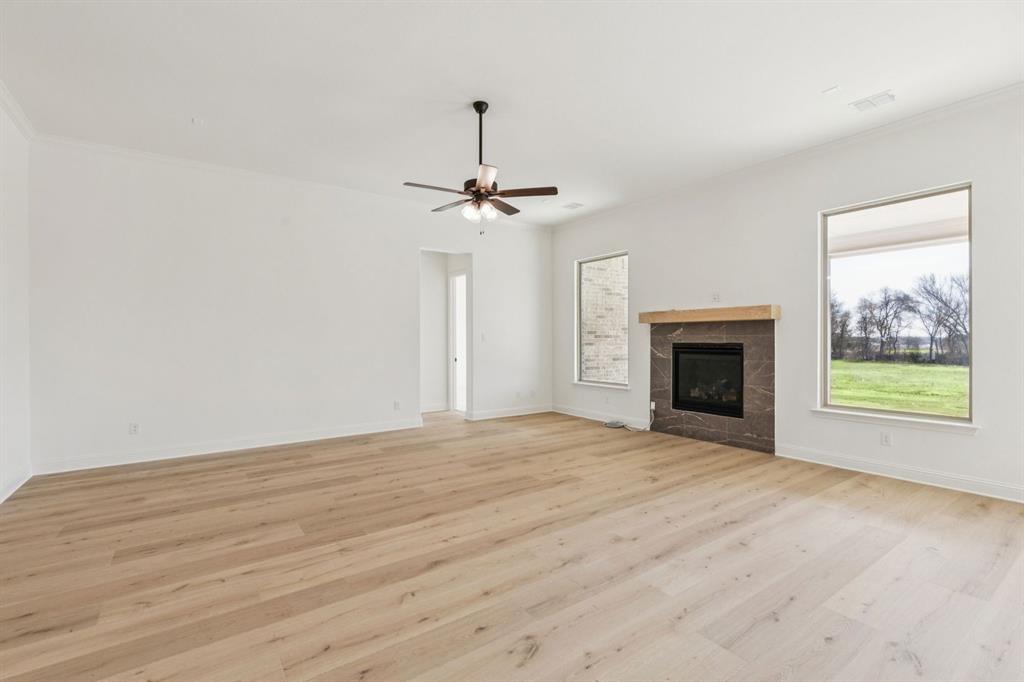 7016 Valley View Drive Joshua, TX 76058 - Photo 13 of 28 a view of empty room with a fireplace and window