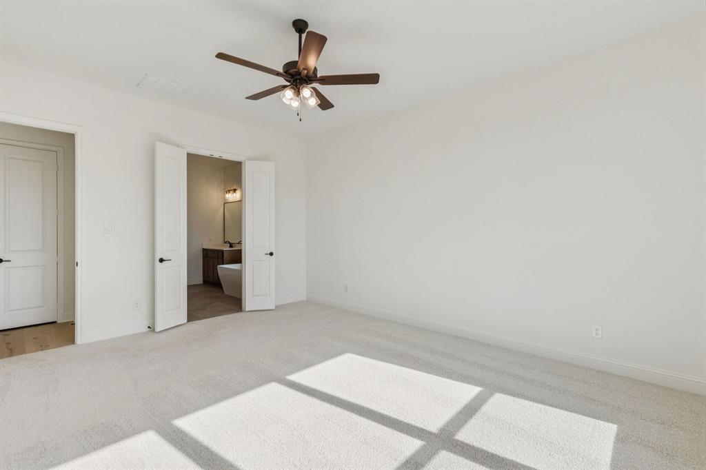 7016 Valley View Drive Joshua, TX 76058 - Photo 15 of 28 a view of a room with a ceiling fan and hardwood floor