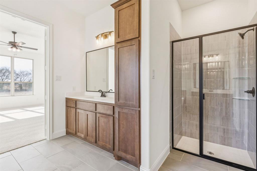 7016 Valley View Drive Joshua, TX 76058 - Photo 18 of 28 a bathroom with a shower and a sink