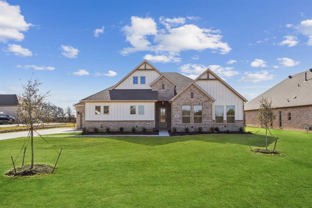 7016 Valley View Drive Joshua, TX 76058 - Photo 2 of 28 a front view of a house with a yard and garage