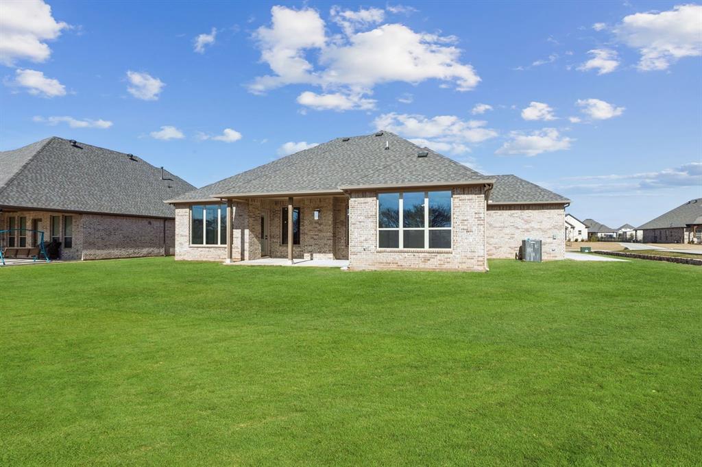 7016 Valley View Drive Joshua, TX 76058 - Photo 27 of 28 a front view of a house with a garden