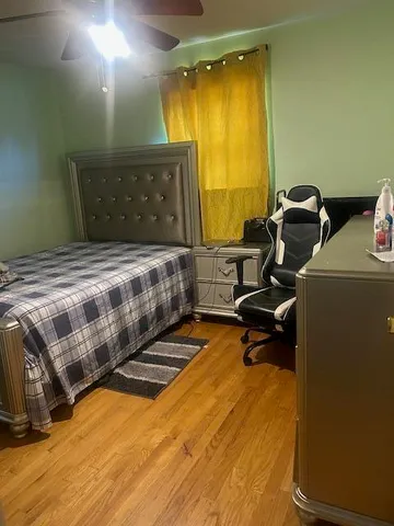 a bedroom with a bed and a table in it