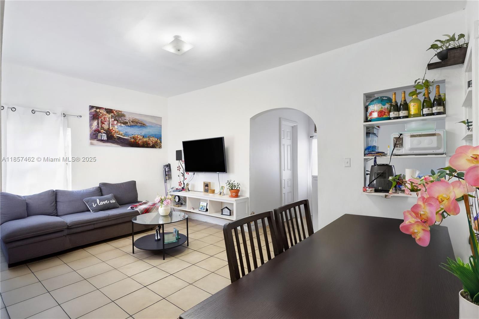 2367 Southwest 19th Street Miami, FL 33145 - Photo 11 of 24 a living room with furniture and a flat screen tv
