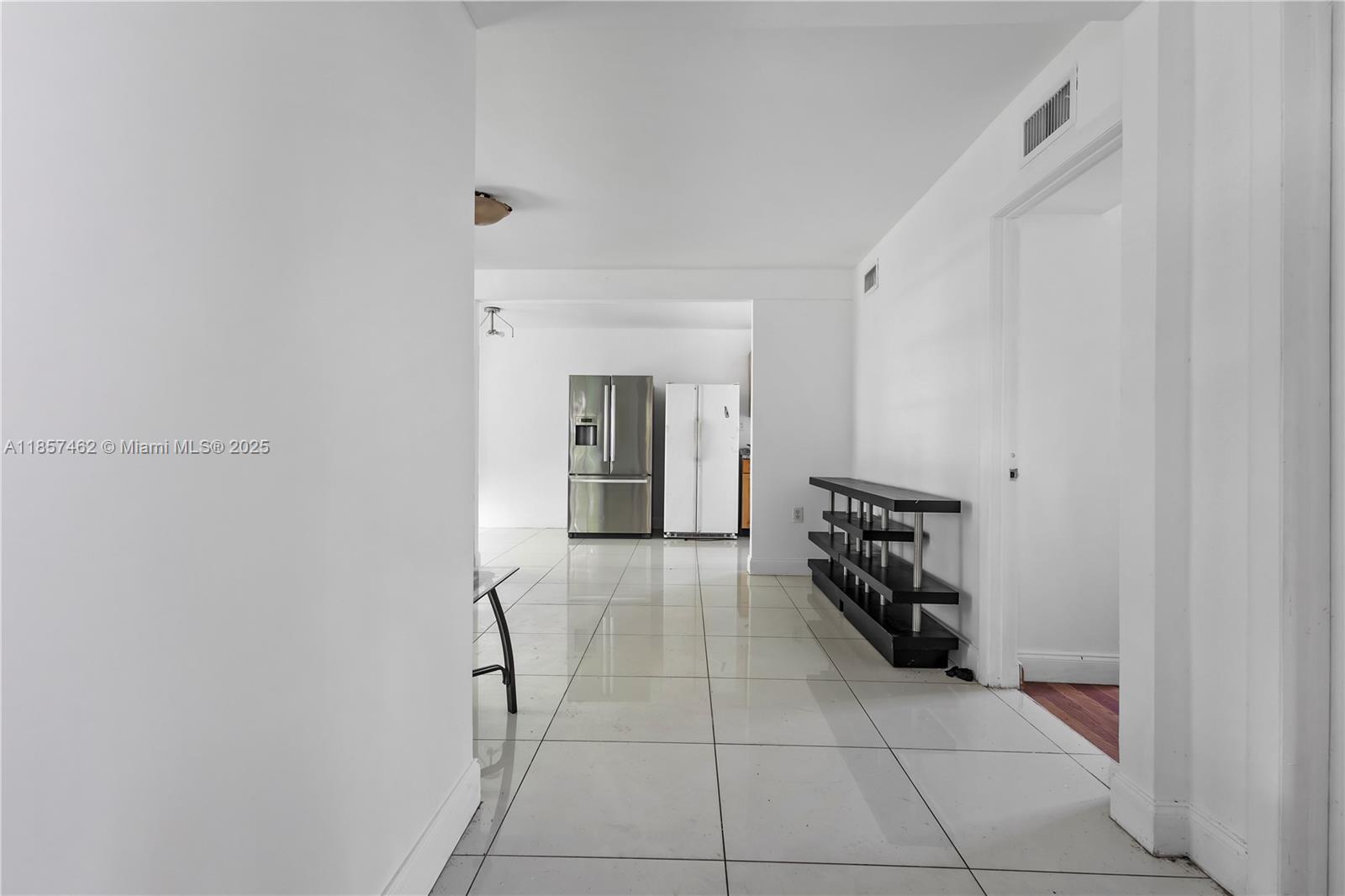 2367 Southwest 19th Street Miami, FL 33145 - Photo 17 of 24 a hallway with a black white checkered floor