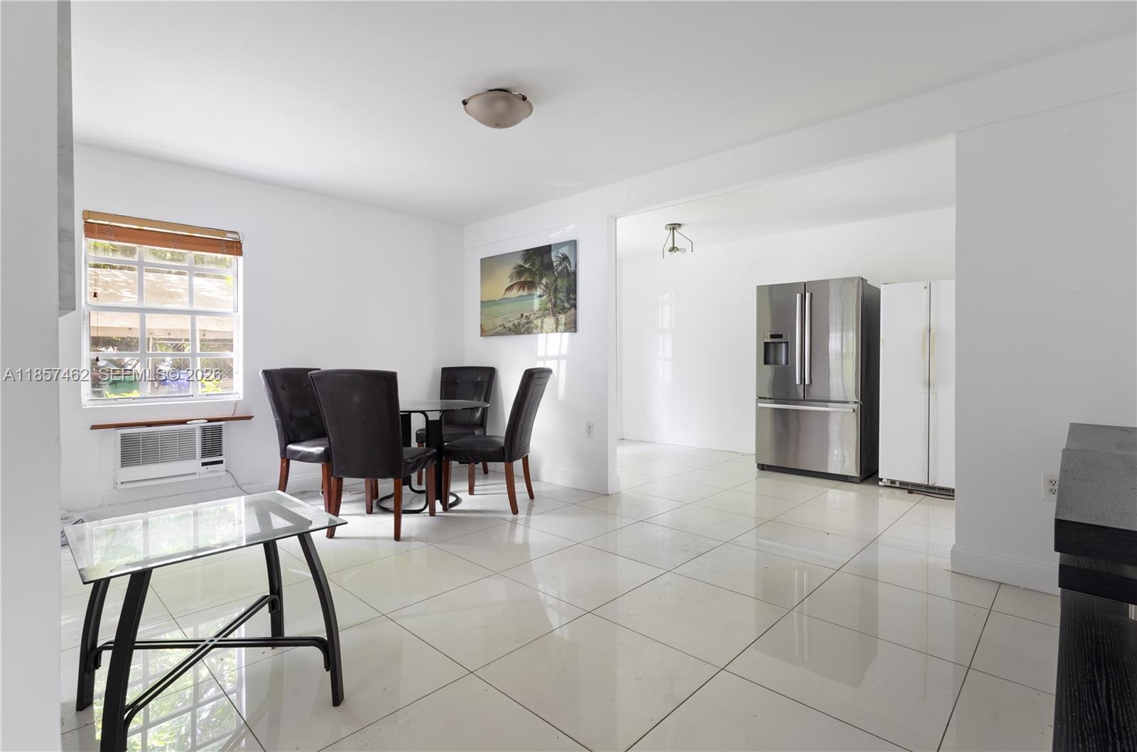 2367 Southwest 19th Street Miami, FL 33145 - Photo 18 of 24 a view of a dining room with furniture and a window