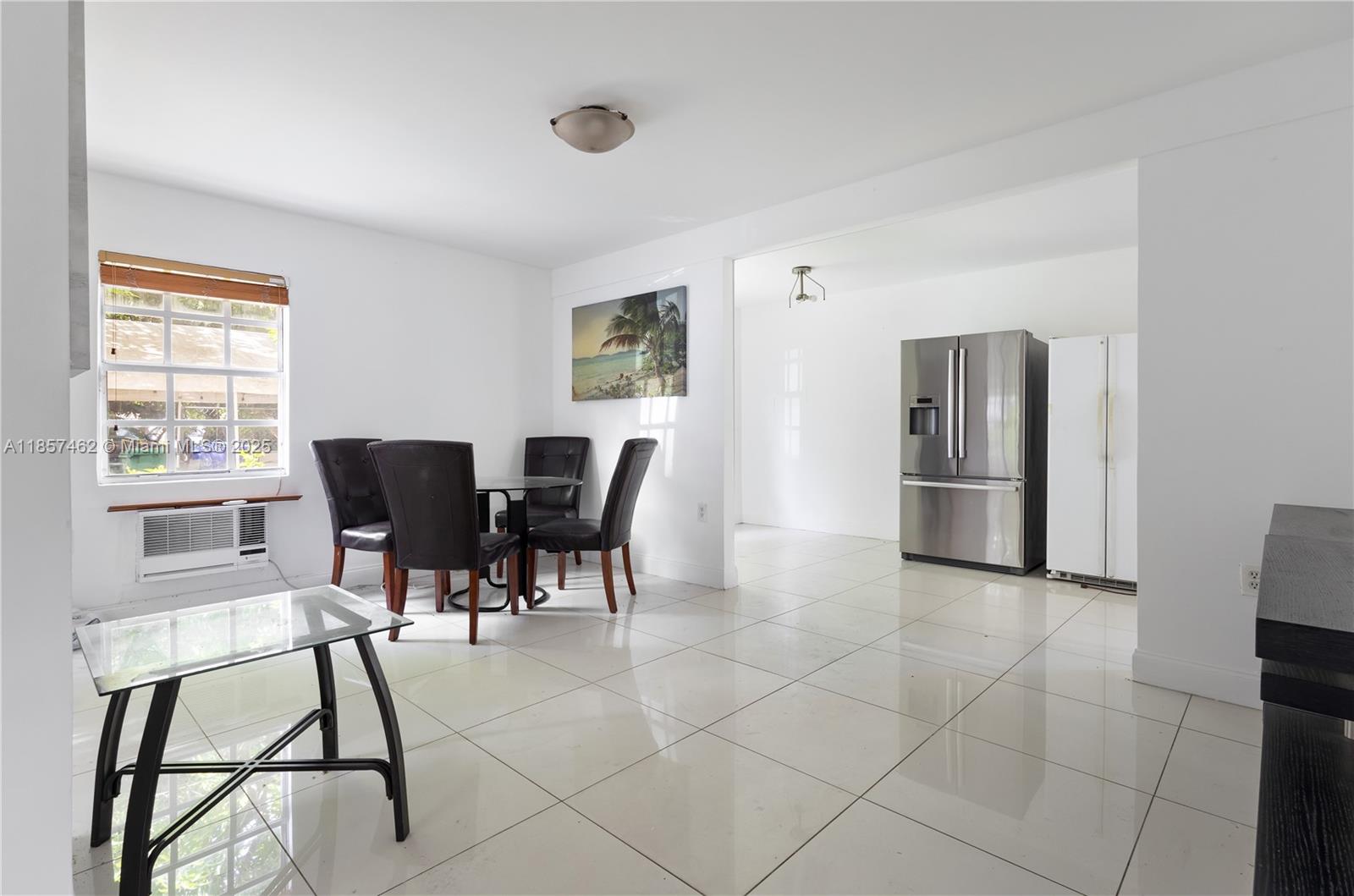 2367 Southwest 19th Street Miami, FL 33145 - Photo 18 of 24 a view of a dining room with furniture and a window