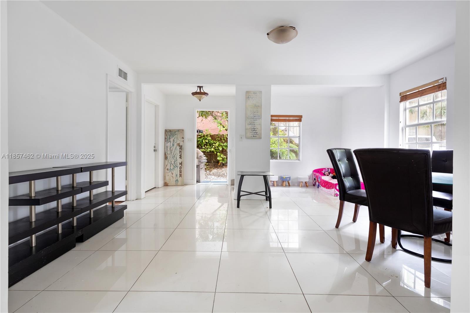 2367 Southwest 19th Street Miami, FL 33145 - Photo 19 of 24 a living room with furniture and a window