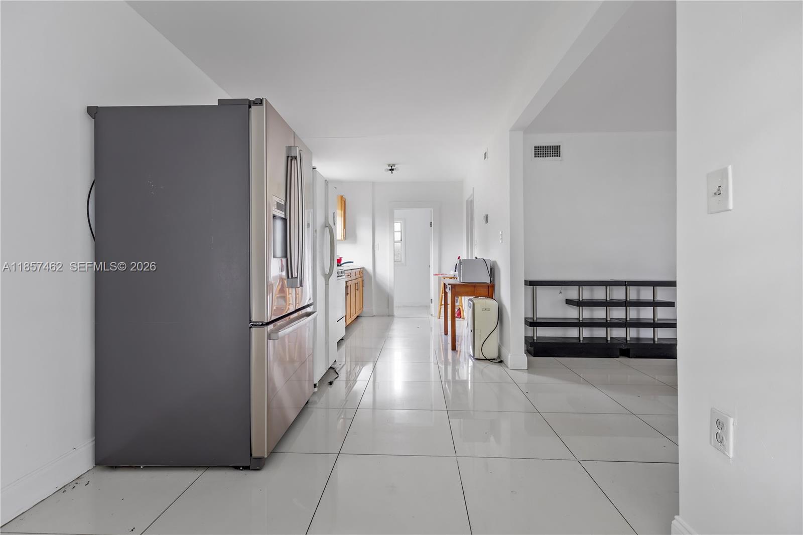 2367 Southwest 19th Street Miami, FL 33145 - Photo 20 of 24 a kitchen with granite countertop a refrigerator and a cabinets
