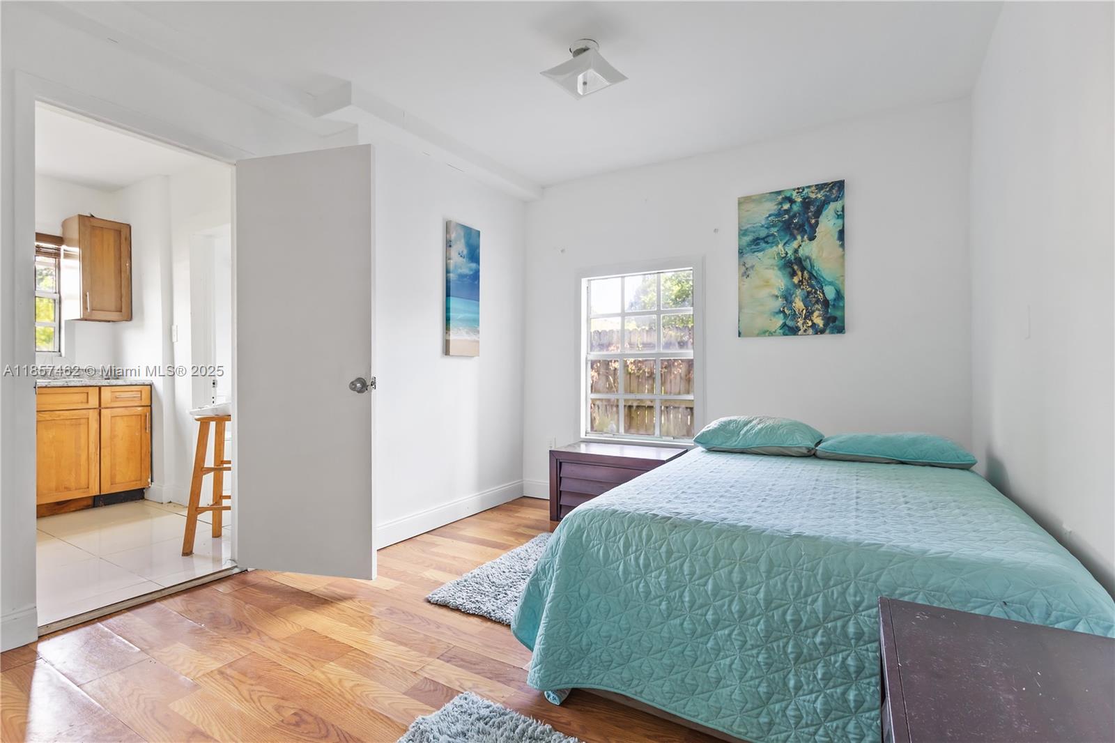 2367 Southwest 19th Street Miami, FL 33145 - Photo 23 of 24 a bedroom with a bed and a window