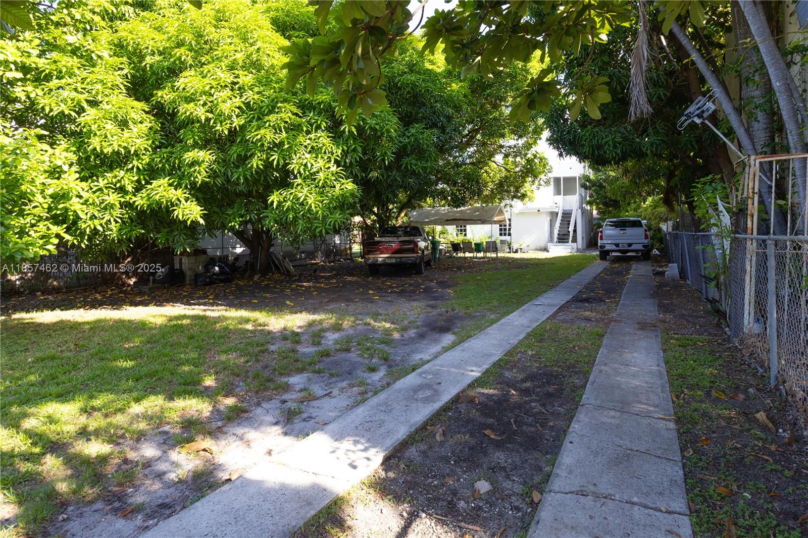 2367 Southwest 19th Street Miami, FL 33145 - Photo 8 of 24 a view of a yard with plants and a bench