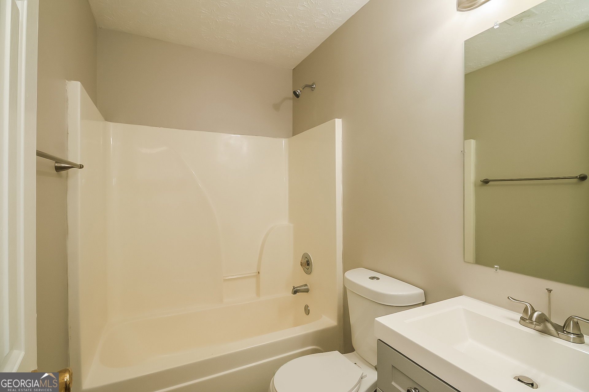 8303 Lakeview Drive Southwest Covington, GA 30014 - Photo 14 of 16 a bathroom with a sink toilet and shower