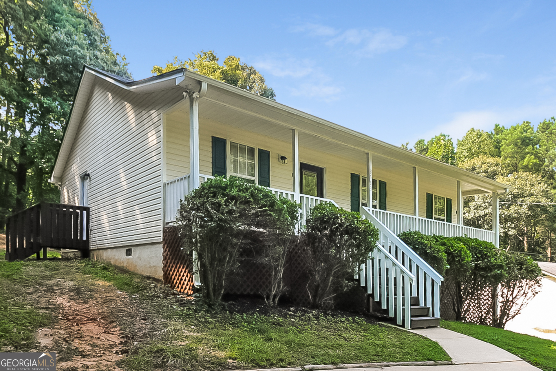 8303 Lakeview Drive Southwest Covington, GA 30014 - Photo 2 of 16 a view of a house with a yard and plants