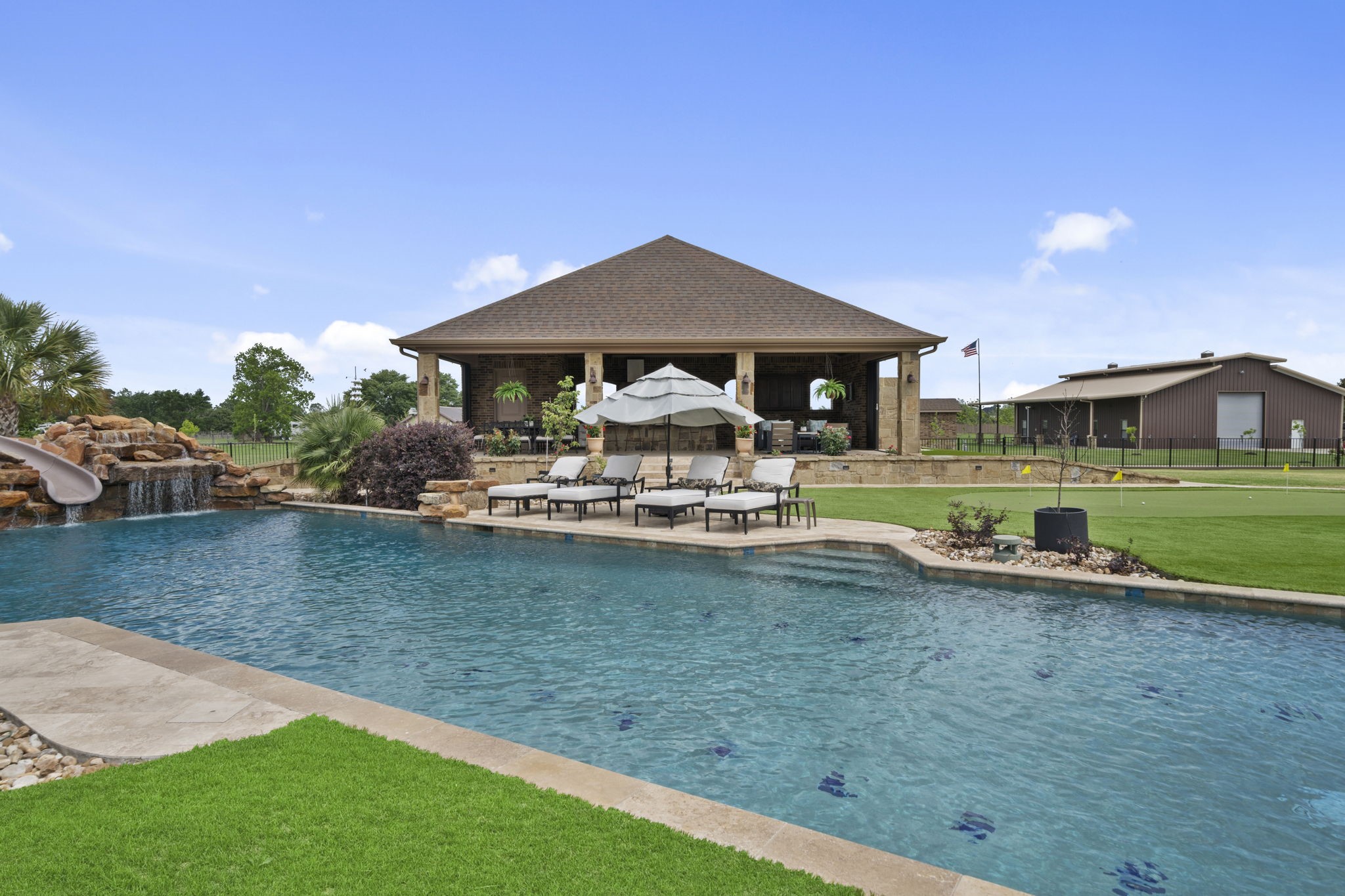 21620 Schiel Road Cypress, TX 77433 - Photo 41 of 49 Another view of the large pool surrounded by turf.