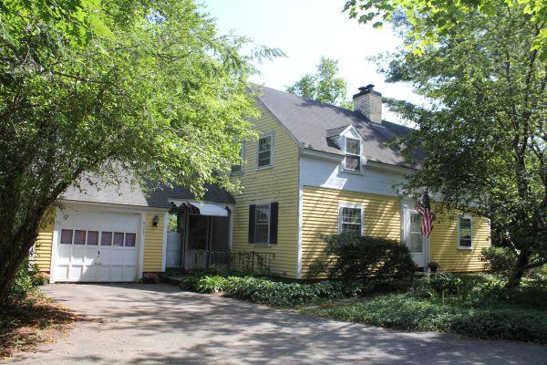 525 Bay Road Hamilton, MA 01982 - Photo 1 of 11 a front view of a house with garden
