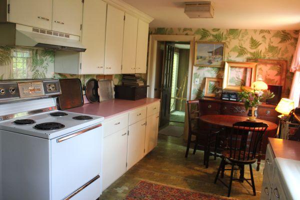 525 Bay Road Hamilton, MA 01982 - Photo 4 of 11 a kitchen with a stove and a cabinets