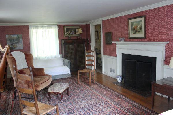 525 Bay Road Hamilton, MA 01982 - Photo 5 of 11 a living room with furniture and a fireplace