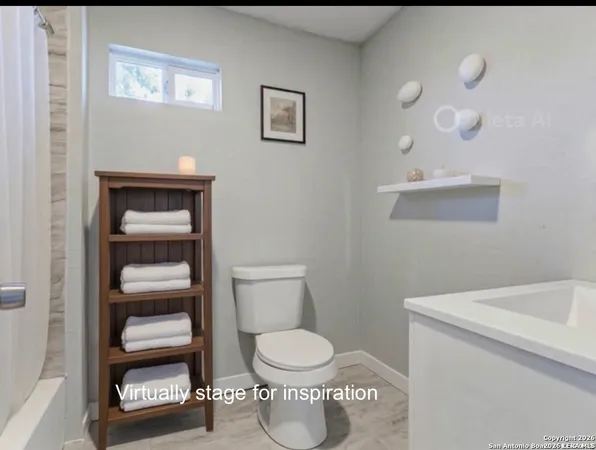 a bathroom with a toilet and a sink