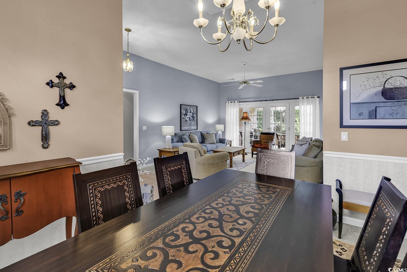 86 Black River Road Myrtle Beach, SC 29588 - Photo 12 of 40 Dining room featuring a chandelier, and a ceiling fan