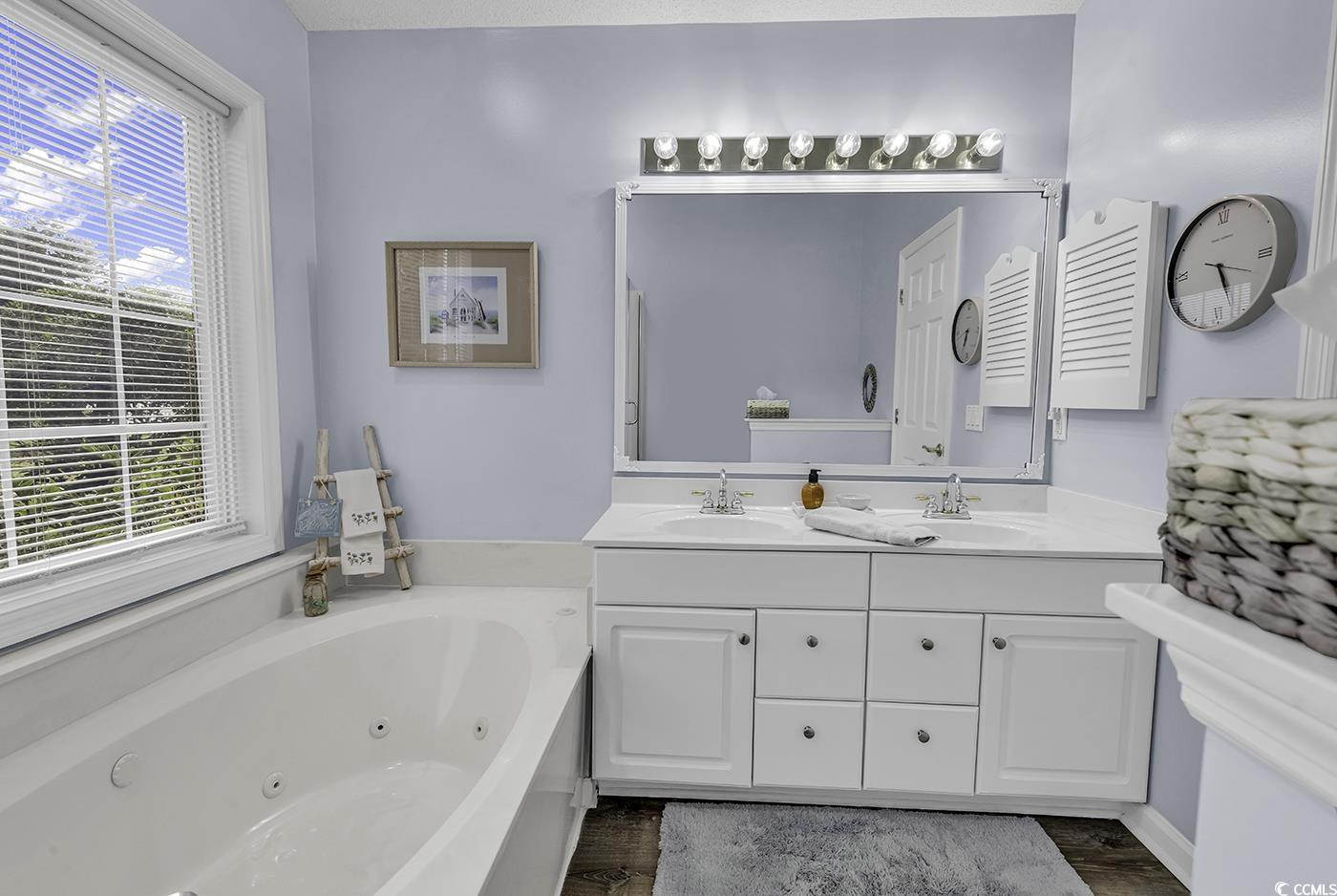 86 Black River Road Myrtle Beach, SC 29588 - Photo 21 of 40 Bathroom featuring a tub with jets, double vanity.