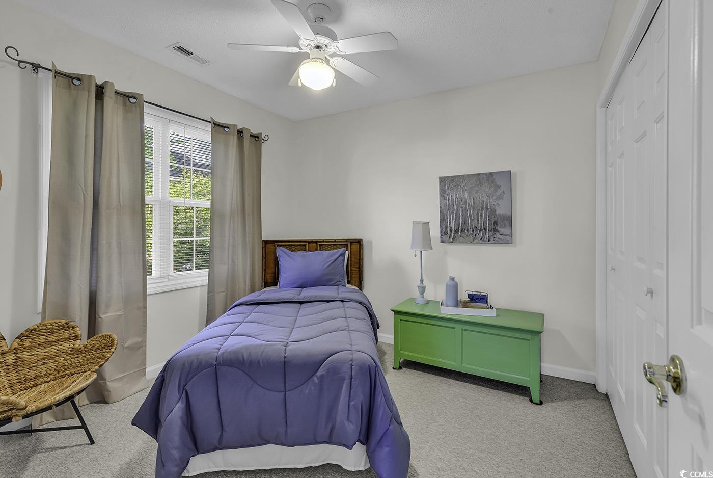 86 Black River Road Myrtle Beach, SC 29588 - Photo 26 of 40 Carpeted bedroom featuring a closet, baseboards, and ceiling fan