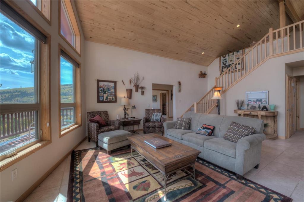3207 High Creek Road Fairplay, CO 80440 - Photo 11 of 35 a living room with furniture and a table