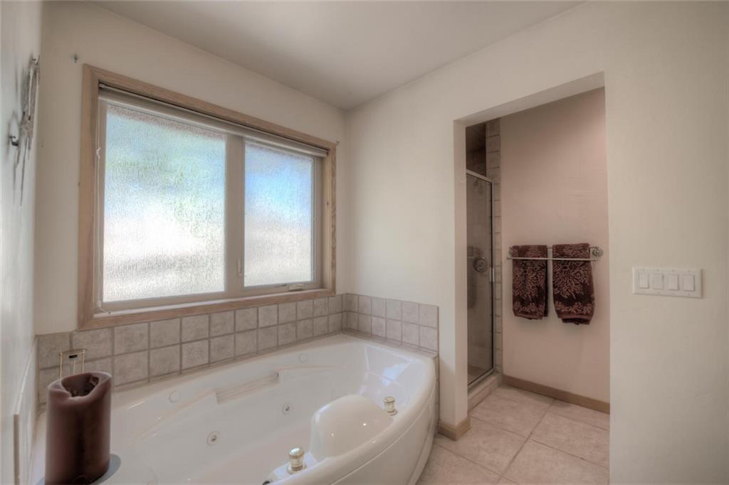 3207 High Creek Road Fairplay, CO 80440 - Photo 16 of 35 a white bath tub sitting in a bathroom