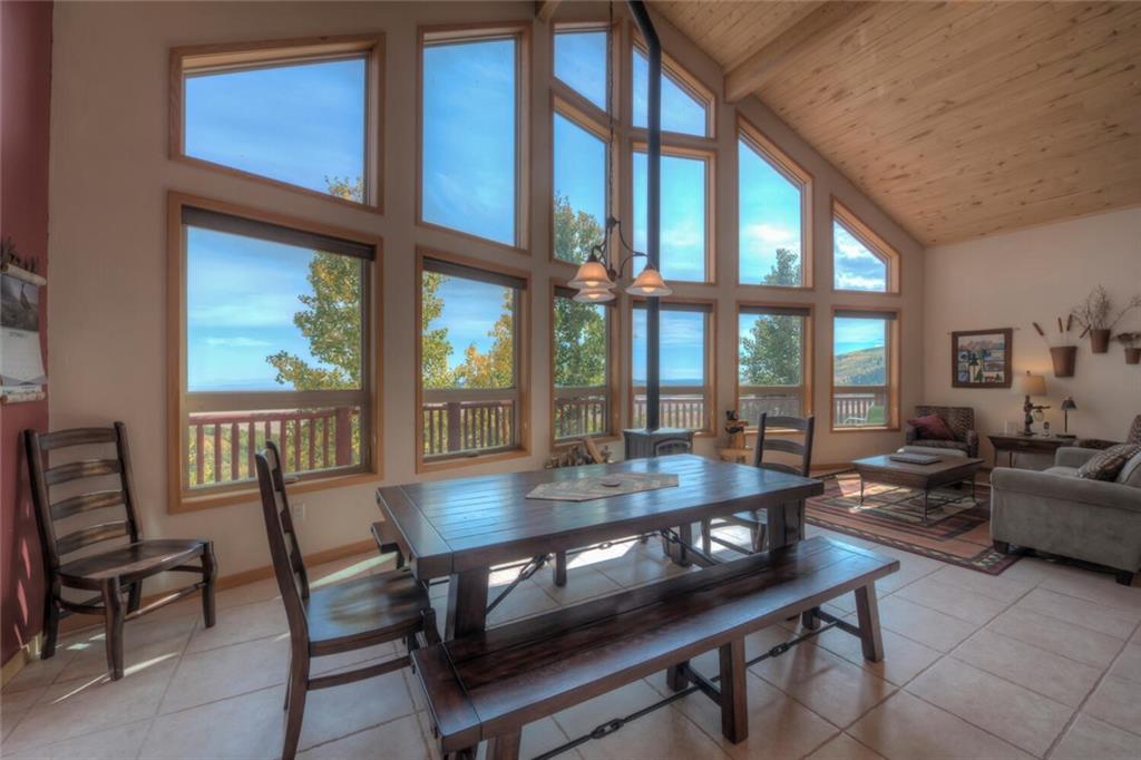 3207 High Creek Road Fairplay, CO 80440 - Photo 2 of 35 a dining room with wooden floor and a table