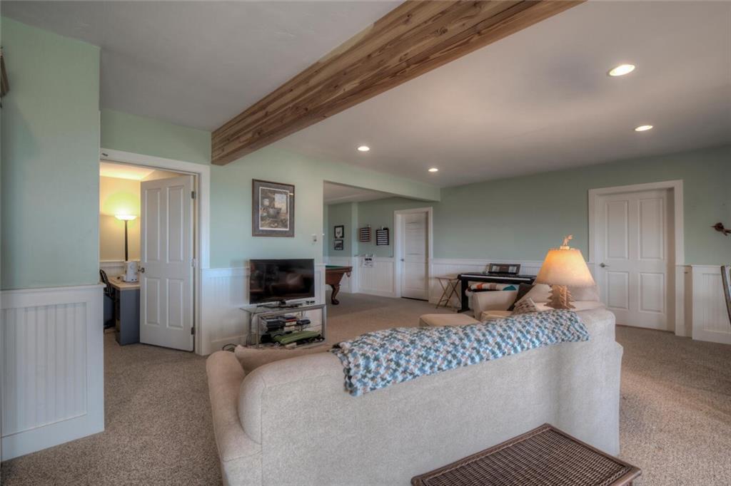 3207 High Creek Road Fairplay, CO 80440 - Photo 23 of 35 a bedroom with furniture and a flat screen tv