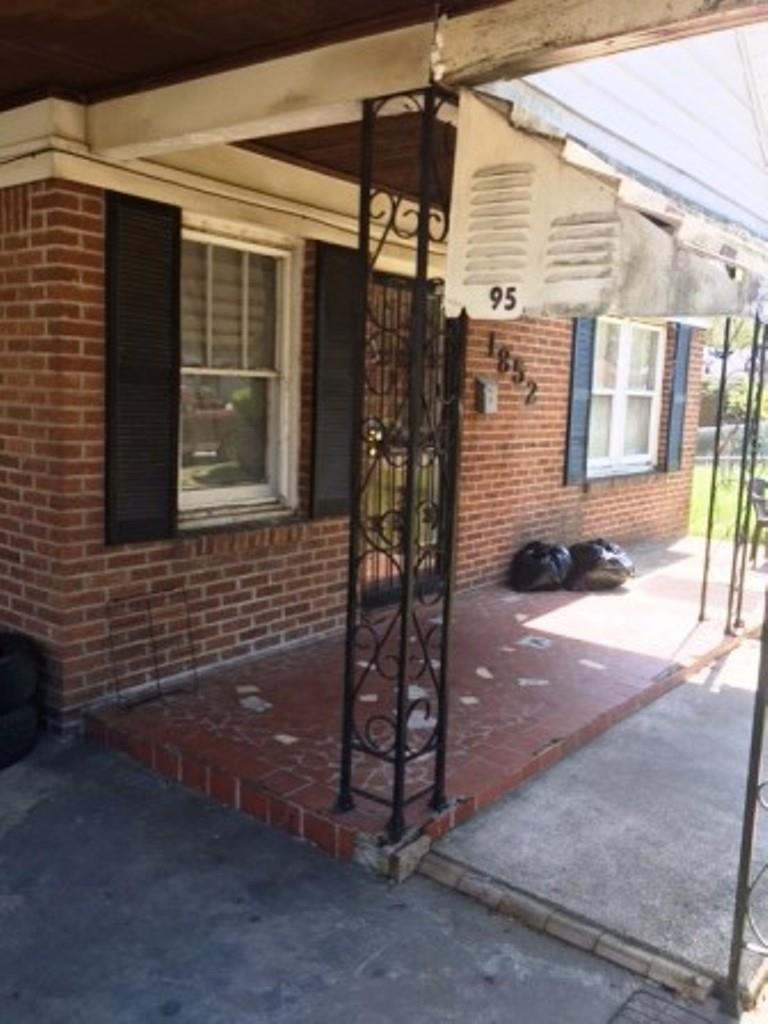 1852 Swift Street Memphis, TN 38109 - Photo 2 of 8 a view of a house with a patio
