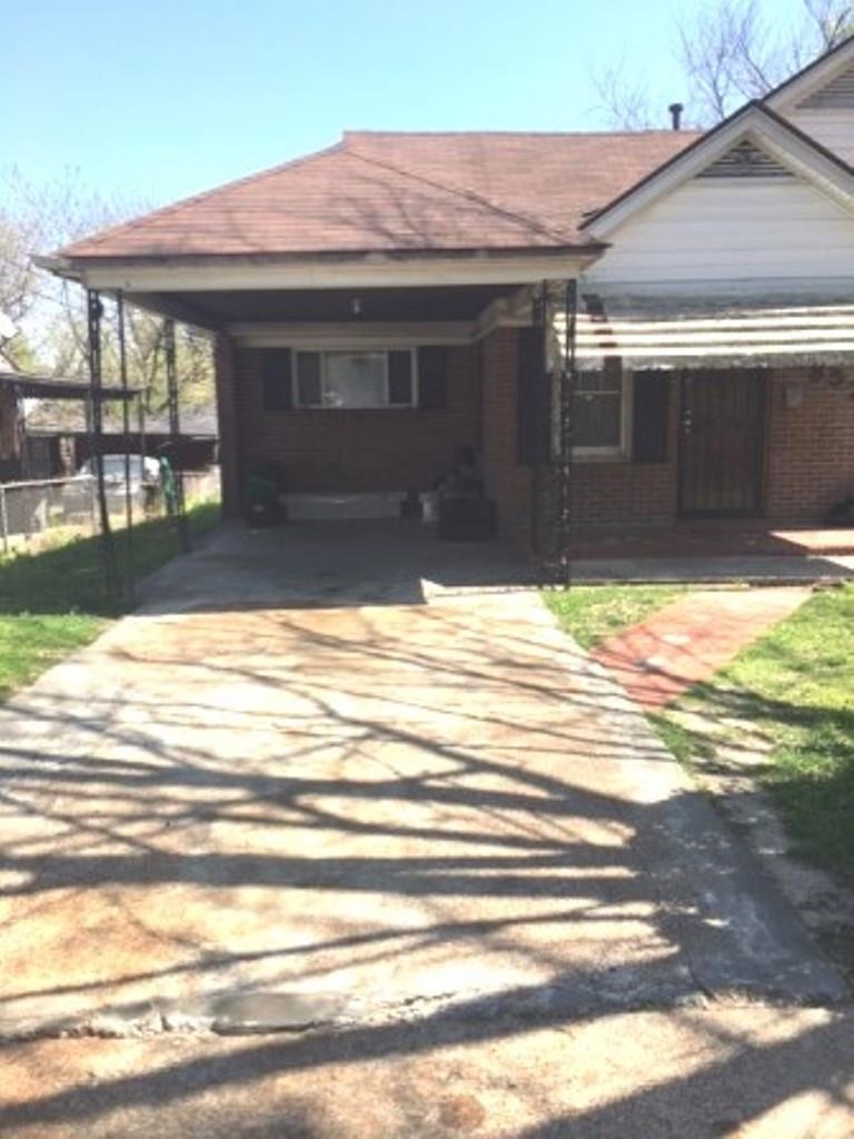 1852 Swift Street Memphis, TN 38109 - Photo 3 of 8 a view of a house with a yard