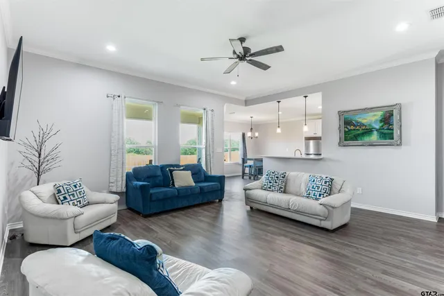 a living room with furniture and a large window